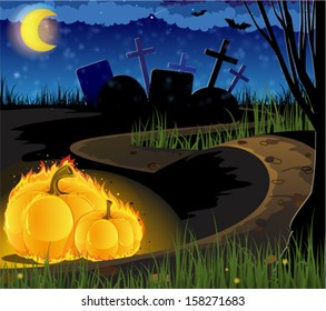 Burning pumpkins on the path leading to the old cemetery