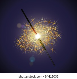 Burning sparkler. On a dark blue background
