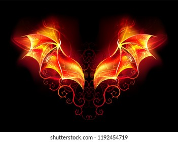 Burning wings of fiery dragon with spiked pattern on black background.