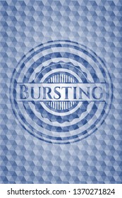 Bursting blue emblem with geometric pattern.