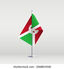 Símbolo del estado de la bandera de Burundi aislado en una bandera nacional de fondo. Tarjeta de saludo Día Nacional de la Independencia de la República de Burundi. Cartel de ilustración con bandera de estado realista.