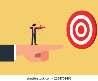 Business advantage or efficiency. businessman Stand and holding a bow on the giant hand pointing to the target, business direction to achieve goal or target
