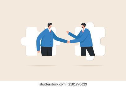 Business agreement partner or coordinating cooperation. Helping or building relationships leads to success. Businessmen handshake on jigsaw puzzle.