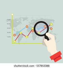 Business analytics and statistics. Businessman study report using a magnifying glass. 
