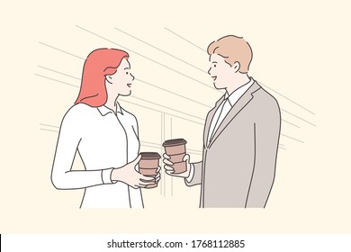 Business, break, communication, friendship concept. Young businessman and woman friends colleagues talking drinking coffee or tea hot beverage at office together. Recreation leisure at lunch time.