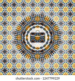 business briefcase icon inside arabic badge. Arabesque decoration.