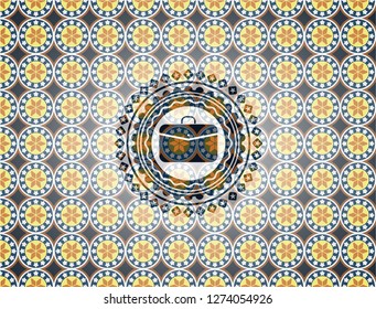 business briefcase icon inside arabic badge. Arabesque decoration.