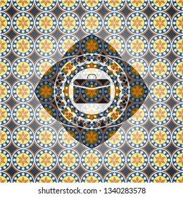 business briefcase icon inside arabic badge. Arabesque decoration.