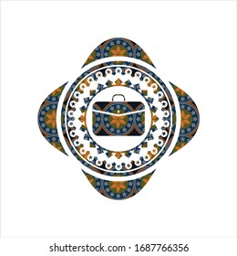 business briefcase icon inside arabic badge. Arabesque decoration.