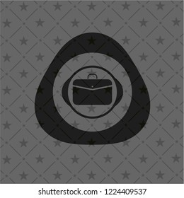 business briefcase icon inside black emblem