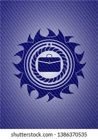 business briefcase icon inside emblem with denim texture