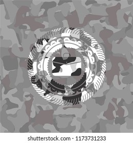 business briefcase icon inside grey camouflage emblem