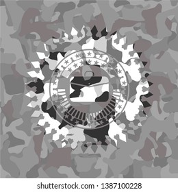 business briefcase icon inside grey camouflage emblem