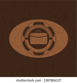 business briefcase icon inside realistic wood emblem