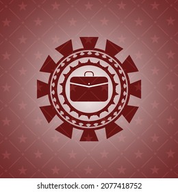 business briefcase icon inside red emblem. 