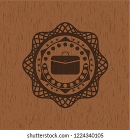 business briefcase icon inside retro wooden emblem