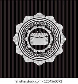 business briefcase icon inside silver emblem