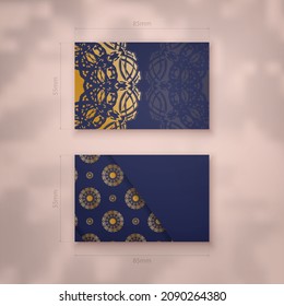 Business card in dark blue with abstract gold ornaments for your business.
