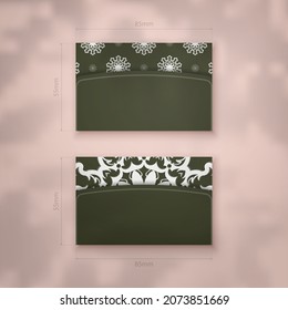 Business card in dark green color with vintage white pattern for your contacts.