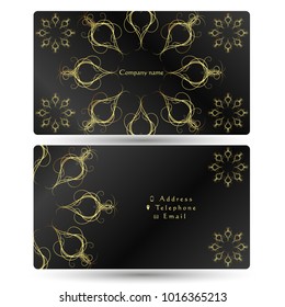Business card gold ornament on a black background concept