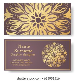 business card with a mandala, gold pattern