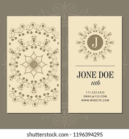 A business card with a mandala and a monogram. Vector illustration.
