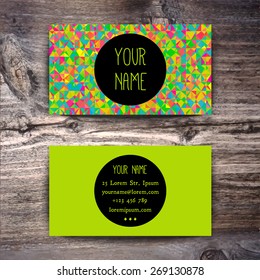 Business card template with creative geometric pattern on wooden background