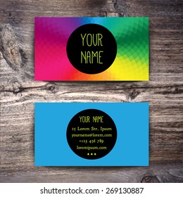Business card template with creative geometric pattern on wooden background