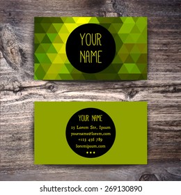 Business card template with creative geometric pattern on wooden background