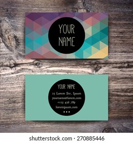 Business card template with creative geometric pattern on wooden background