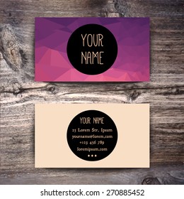 Business card template with creative geometric pattern on wooden background