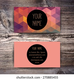 Business card template with creative geometric pattern on wooden background