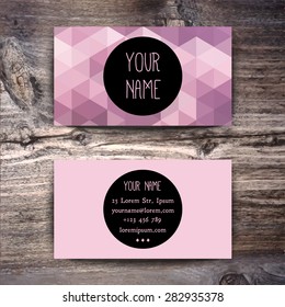 Business card template with creative geometric pattern on wooden background