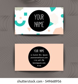 Business card template with creative geometric colorful texture on wooden background