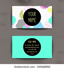 Business card template with creative geometric colorful texture on wooden background