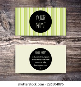 Business card template with creative retro pattern on wooden background