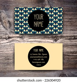 Business card template with creative retro pattern on wooden background