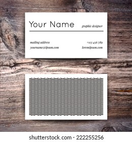 Business card template with creative white and black retro pattern on wooden background