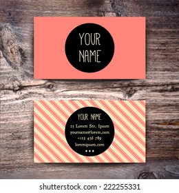 Business card template with creative white and black retro pattern on wooden background