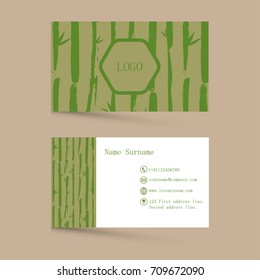 Business card template isolated on grey background. Contact card for company with green bamboo leaf pattern and contact details. EPS10 vector illustration for company, identity. Two sided.