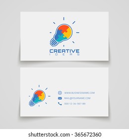 Business card template. Light bulb with jigsaw puzzle pieces inside. Conceptual logo. Vector illustration.
