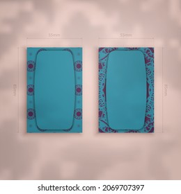 Business card template in turquoise color with greek purple pattern for your business.