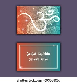 Business card for yoga studio or yoga instructor. Ethnic background with mandala ornament and ohm.