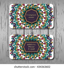 Business cards, corporate identity, corporate style, round pattern with purple, green, yellow poligons, boho, hipster background, wood texture