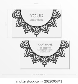 Business cards in white with black ornaments. Business card design with monogram patterns.