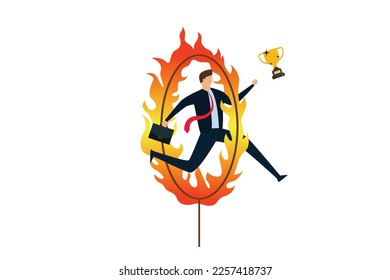 Business challenge, obstacle, risk or danger to overcome in order to achieve success, businessman skillfully jumps through hot hoops to win the victory trophy.