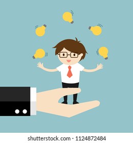 Business concept, businessman juggling many light bulbs while standing on the big hand.
