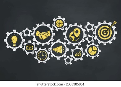 Business concept with gear on the blackboard. Yellow icons in gears.