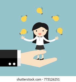 Business concept, business woman juggling many light bulbs while standing on the big hand.