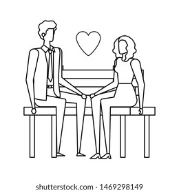 business couple lovers seated in the park chair with heart